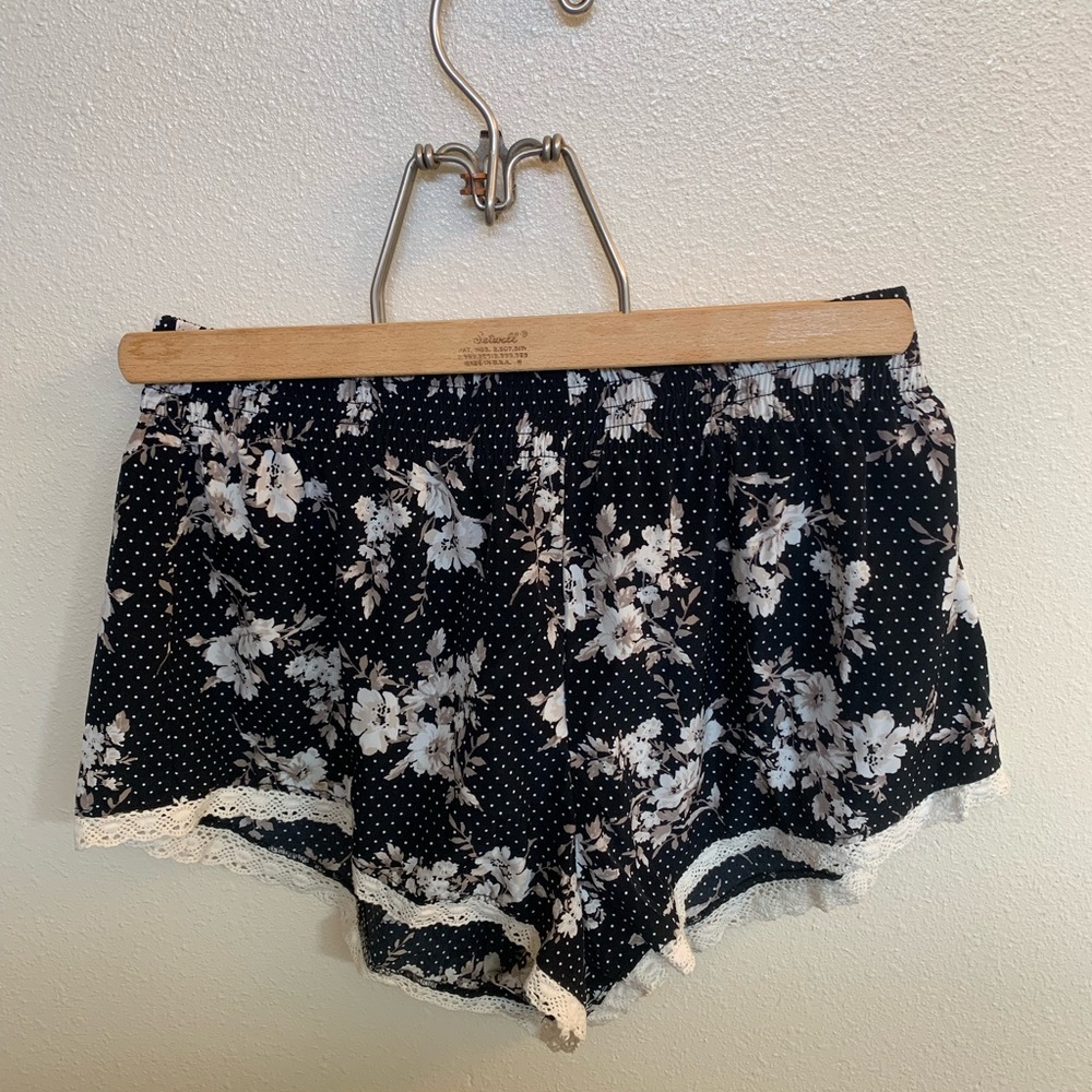 Silky, black with floral print shorts. Size medium, fits more like a small.